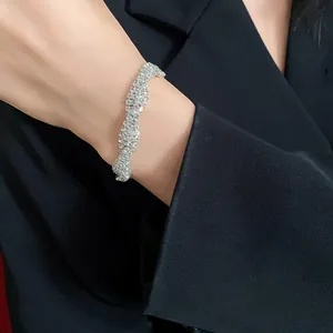 Macro view of a sparkling twisted silver bracelet with premium rhinestone inlay