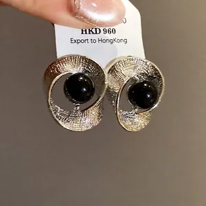 Sophisticated silver needle twisted wrinkled earrings with chic black central bead decor