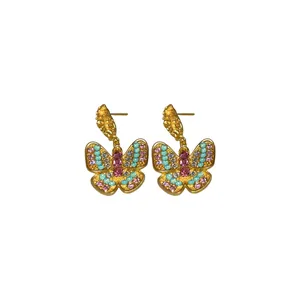 Elegant vintage butterfly earrings with colorful crystals and wrinkled gold texture finish.