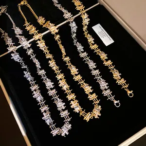 Detailed view of zircon irregular square spliced necklaces in gold and silver colors