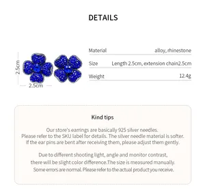 Detailed macro view of elegant blue rhinestone flower earrings with 925 silver needles.