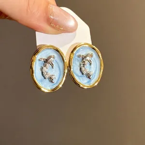 Vintage oval goldfish earrings with pearls and blue enamel in gold frames