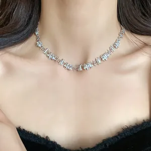Close-up of elegant court style silver necklace with irregular zircon square links on neck