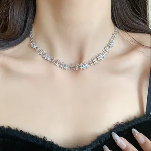 Close-up of elegant silver choker necklace featuring irregular square zircon links on model