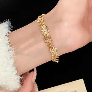 Detailed view of an elegant gold-plated zircon bracelet with irregular square links