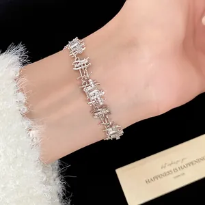 Detail shot of luxury silver zircon bracelet with irregular square links on wrist