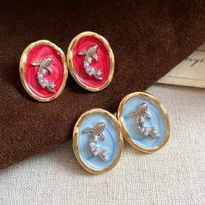 Vintage oval earrings with goldfish design and pearls in red and blue enamel finish
