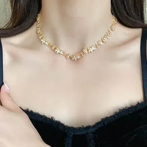 Close-up of elegant gold-toned zircon choker with irregular geometric links