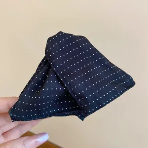 Chic black and white polka dot triangular fabric hair claw clip for elegant hairstyles
