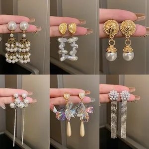 French vintage pearl and tassel earrings collection with luxury elegant designs