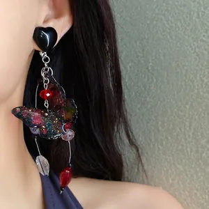 Sweet butterfly tassel earrings with galaxy finish, perfect for beach vacations.
