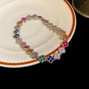 Luxurious multicolored cubic zirconia four-leaf clover bracelet with silver-tone finish