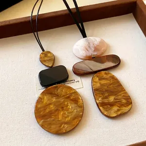 Vintage geometric resin pendant necklace with brown marble texture and leather cord