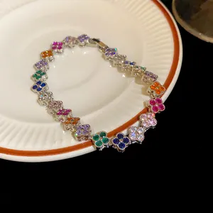 Micro-inlaid zircon clover bracelet with multi-colored stones for a luxurious look.