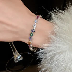 Elegant multi-color micro-pave zircon four-leaf clover bracelet with irregular clasp