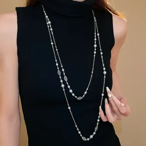 Elegant long double-layer pearl necklace with vintage silver floral accents for women