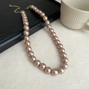 Elegant champagne faux pearl necklace with high-end retro aesthetic