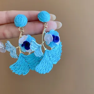Handmade blue raffia ginkgo leaf drop earrings with delicate fabric flower accents