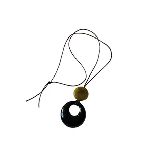 Elegant resin ring pendant necklace with black cord for retro sweater styling