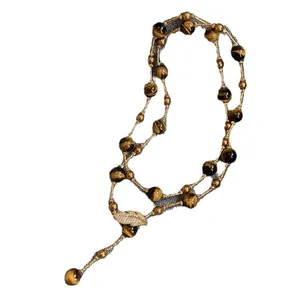 Vintage long beaded necklace with tiger eye stones and a sparkling leaf charm pendant