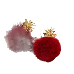 Elegant red flocked pom-pom earrings with golden sunburst stud design for women
