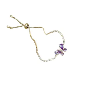 Elegant gold adjustable slider bracelet featuring a purple cubic zirconia butterfly charm