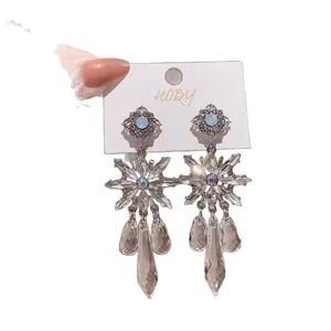 Silver needle flower earrings featuring crystal waterdrop tassels and rhinestone accents