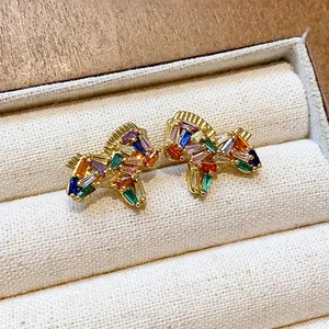 Detailed view of 18K gold-plated pony stud earrings set with colorful zircons