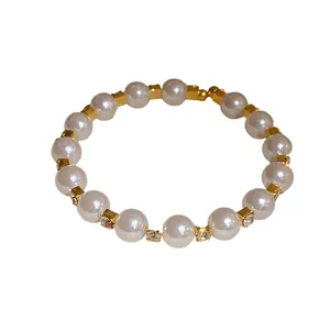 Elegant French retro pearl bracelet with gold-toned rhinestone spacers
