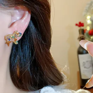 Close-up of 18K gold-plated horse stud earring with multi-colored zircon stones