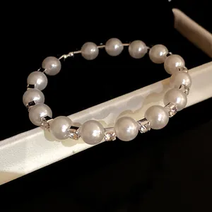 Close-up of elegant French vintage pearl bracelet with sparkling rhinestone spacers