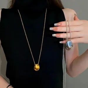 Minimalist titanium steel oval pendant long sweater chain necklace in gold and silver finish