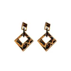 Retro geometric rhombus earrings with leopard print and gold-tone metal frame.