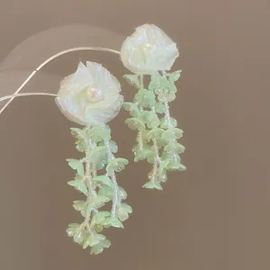 Elegant white fabric flower earrings with light green glass bead tassels for women