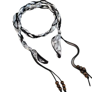 Vintage ethnic style fabric waist chain with paisley print and wooden beads.