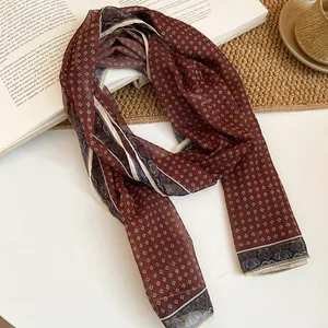 Vintage ethnic style burgundy silk scarf with geometric diamond pattern detail view