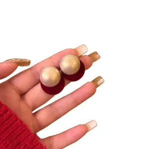 Elegant round pearl stud earrings featuring red velvet base and s925 silver needles