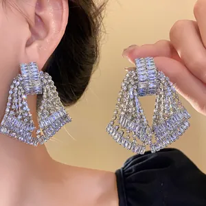 Detailed view of luxury rhinestone chandelier tassel earrings with shimmering crystals