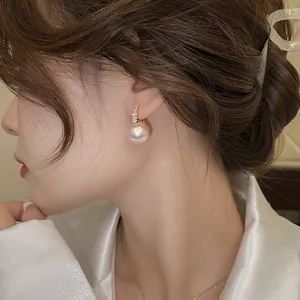 Elegant French retro pink pearl earrings with shimmering diamond accents for women.