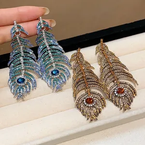 Luxury silver needle feather drop earrings adorned with shimmering colorful rhinestones