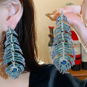 Elegant feather dangle earrings with blue and green rhinestones for women