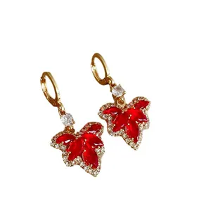 Luxury red crystal maple leaf drop earrings with gold finish and sparkling rhinestones