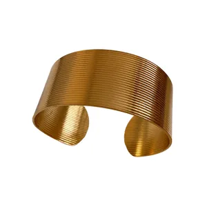 Textured gold stainless steel wide cuff bracelet with horizontal ribbing pattern