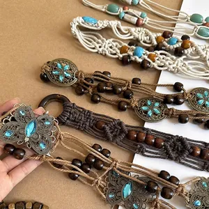 Detailed close-up of handmade Bohemian braided waist chain with butterfly buckle