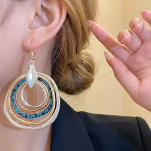 Vintage multi-layer irregular circular dangle earrings with teal textured accents