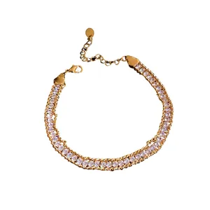 Elegant gold plated twisted chain bracelet with shimmering zirconia stones