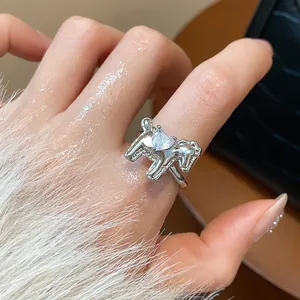 Close-up of elegant silver horse ring featuring a sparkling heart-shaped zirconia