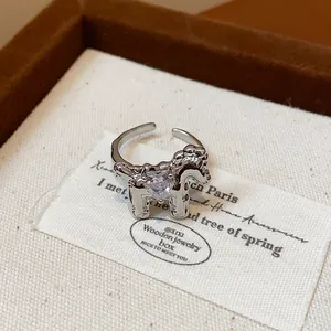 Exquisite detail of a silver horse-shaped adjustable ring featuring a heart zircon
