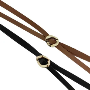 Set of black and brown skinny fashion belts featuring irregular gold-toned metal buckles.
