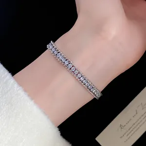 Elegant sparkling twisted chain bracelet worn on wrist with luxury detail